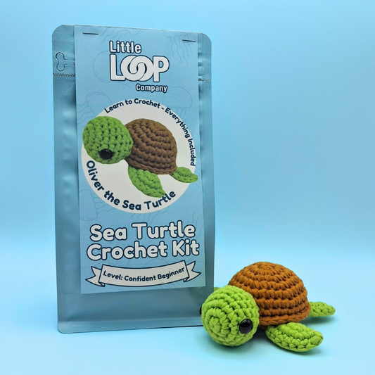 Crochet kit for making a sea turtle with packaging labeled 'Little Loop Company' on a blue background.